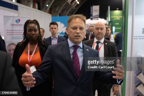 Britain's Defence Secretary, Grant Schapps, visits stalls in the exhibition hall on the third day of the Conservative Party Conference on October 03,...