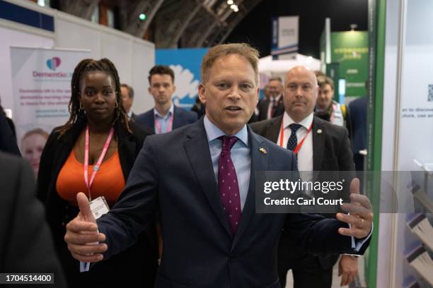 Britain's Defence Secretary, Grant Schapps, visits stalls in the exhibition hall on the third day of the Conservative Party Conference on October 03,...