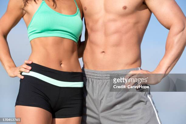 fit torso - muscle men at beach stockfoto's en -beelden