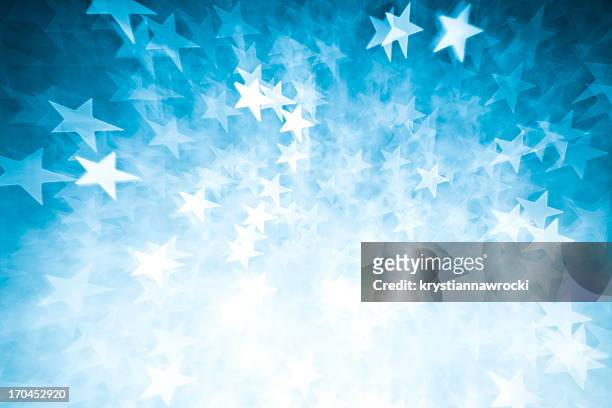 blurred blue star shape lights - star shape stock pictures, royalty-free photos & images