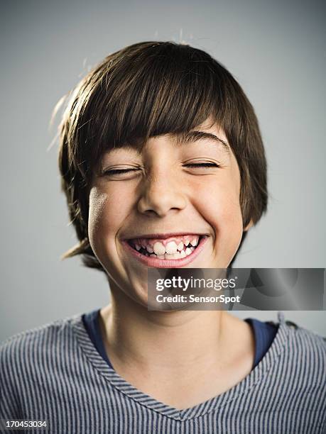 young boy smiling - boy with long hair stock pictures, royalty-free photos & images