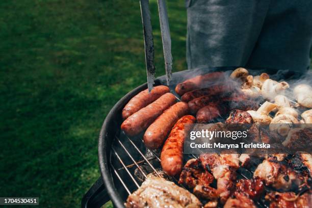 grilled meat, sausages and mushrooms. b-b-q. food in nature. cooking food on the grill. picnic. holiday in nature. - bbq sausage stock pictures, royalty-free photos & images