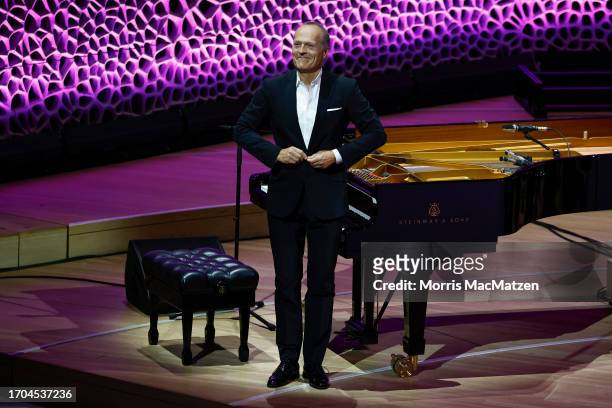 Pianist Jodi Wendt performs during a ceremony in Hamburg's Elbphilharmonie opera house as part of the celebrations on German Unity Day on October 3,...