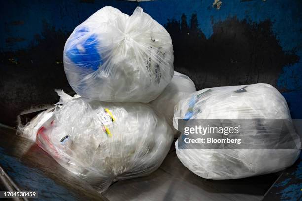 Plastic film is loaded into a baler at an ACME and Safeway Distribution Center in Denver, Pennsylvania, US, on Tuesday, June 20, 2023. More than 500...