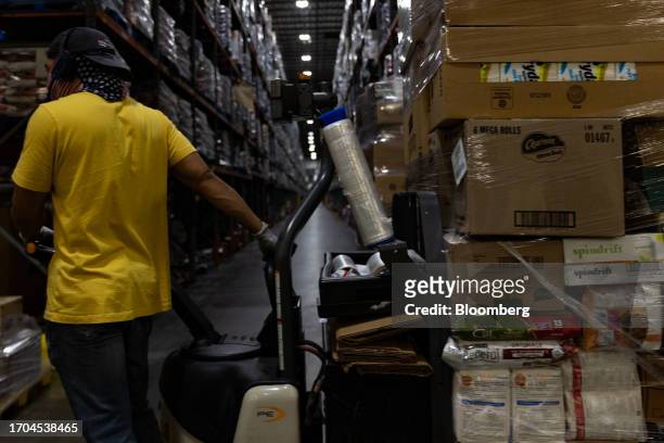 Worker moves a pallet of grocery items at an ACME and Safeway Distribution Center in Denver, Pennsylvania, US, on Tuesday, June 20, 2023. More than...