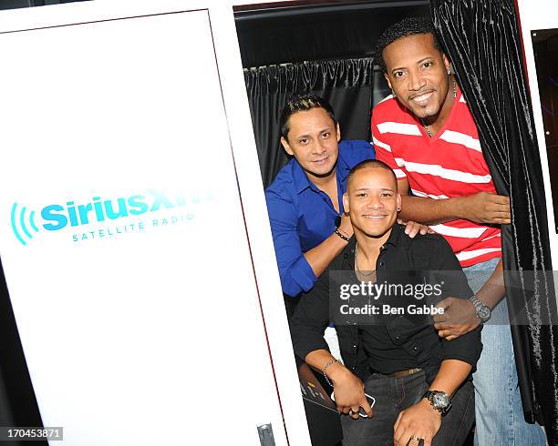 Mauricio Guerrero, Yuri Toro and Elvis Magno of the salsa band Grupo Niche visit the SiriusXM Studios on June 13, 2013 in New York City.