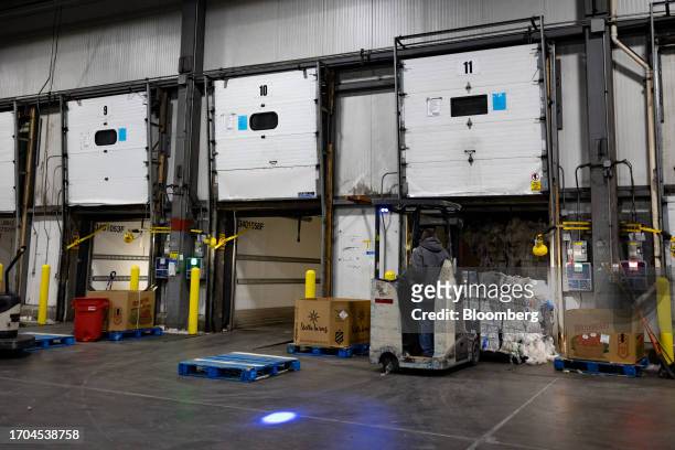 Worker loads recyclable plastics from a trailer at an ACME and Safeway Distribution Center in Denver, Pennsylvania, US, on Tuesday, June 20, 2023....