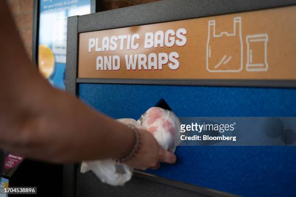 Plastic bags are placed into a recycling collection bin outside an ACME Markets grocery store and pharmacy in Thorndale, Pennsylvania, US, on...