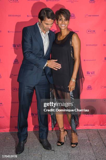 Halle Berry and Olivier Martinez attend the 'Toiles Enchantees' Red Carpet as part of the Champs Elysees Film Festival 2013 at Publicis Champs...