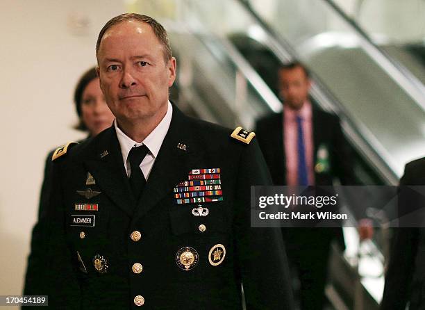 Army Gen. Keith Alexander, Director National Security Agency , and head of the US Cyber Command walks to a closed door U.S. Senate Intelligence...