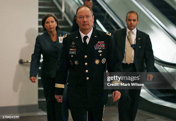 Army Gen. Keith Alexander, Director National Security Agency , and head of the US Cyber Command walks to a closed door U.S. Senate Intelligence...