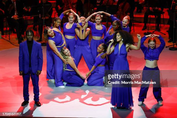 Singers Joshua -JFI- Fielder and Grace -Gege- Owusu and dancers of the Hiphop Academy Hamburg perform during a ceremony in Hamburg's Elbphilharmonie...