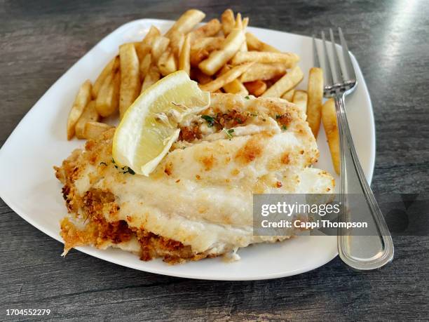 baked stuffed haddock with french fries - haddock stock pictures, royalty-free photos & images