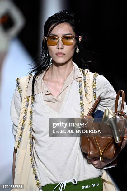Model walks on the runway to present a creation by Miu Miu during the Paris Fashion Week Womenswear Spring/Summer 2024 in Paris on October 3, 2023.