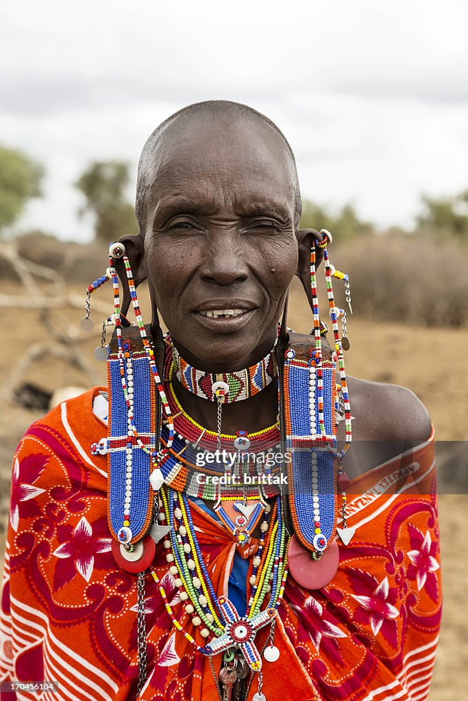 Old maasai woman with impressive traditional colorful pearl jewellery.