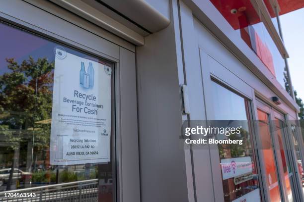 Sign informs customers of a recycling for cash program outside a Target store in Aliso Viejo, California, US, on Tuesday, June 20, 2023. More than...