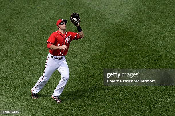 Stephen Lombardozzi of the Washington Nationals makes a catch during a game against the Minnesota Twins at Nationals Park on June 9, 2013 in...