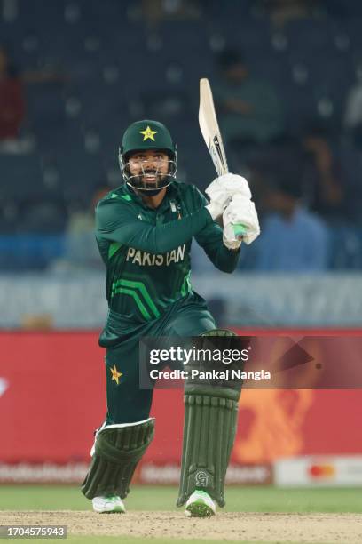 Shadab Khan of Pakistan plays a shot during the ICC Men's Cricket World Cup India 2023 warm up match between Pakistan and Australia at Rajiv Gandhi...