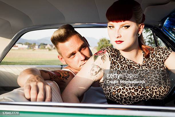 beautiful rockabilly couple - pin up girl tattoo stock pictures, royalty-free photos & images
