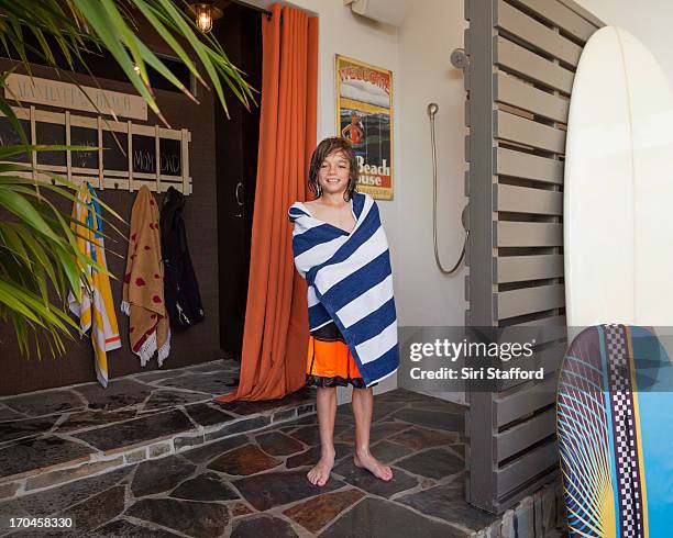 young boy in outdoor shower wrapped in towel - boys taking a shower stock pictures, royalty-free photos & images