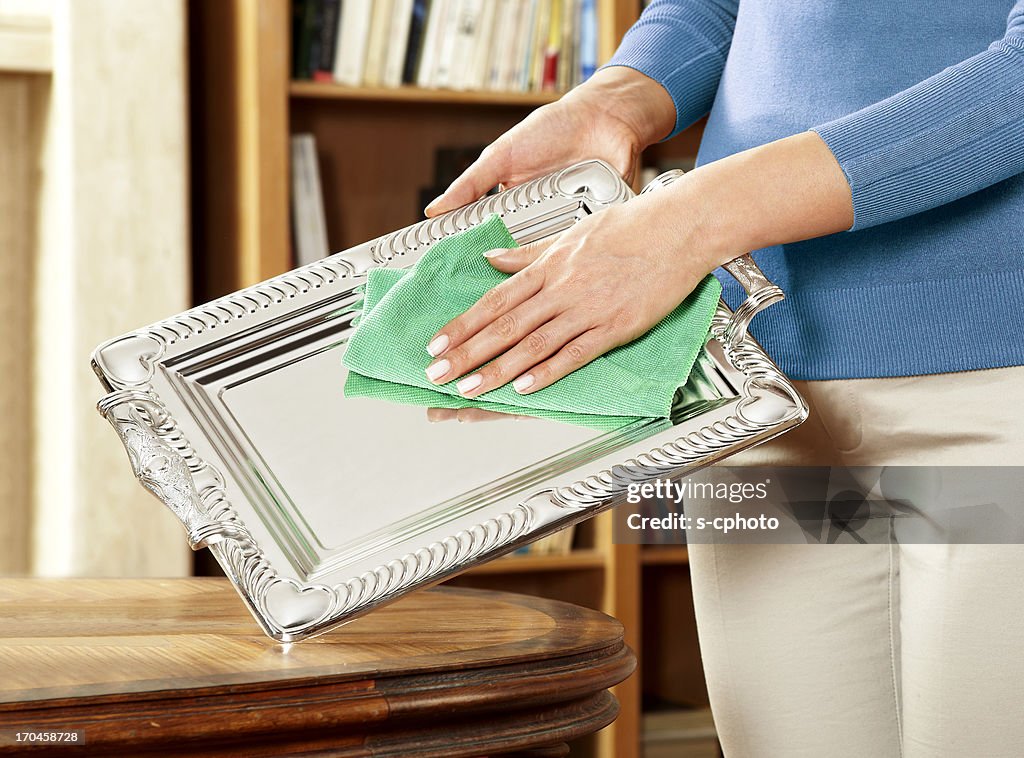 Woman Cleaning Silverware