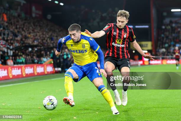 Lynden Gooch of Stoke City holds off David Brooks of Bournemouth during the Carabao Cup Third Round match between AFC Bournemouth and Stoke City at...