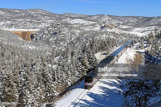 passenger train leaving crescent - denver winter stock pictures, royalty-free photos & images