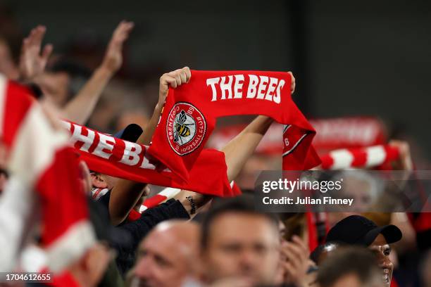 Brentford fans show their support during the Carabao Cup Third Round match between Brentford and Arsenal at Gtech Community Stadium on September 27,...