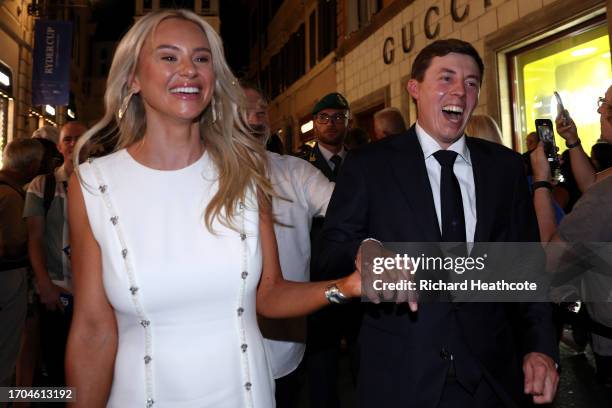 Matt Fitzpatrick of Team Europe and fiance Katherine Gaal walk through fans at the Spanish Steps prior to the 2023 Ryder Cup at Marco Simone Golf...