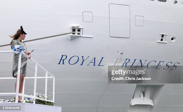Captain Tony Draper and Catherine, Duchess of Cambridge watch the bottle of Moet & Chandon Brut Imperial Champagne break against the ship for the...
