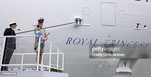 Captain Tony Draper and Catherine, Duchess of Cambridge watch the bottle of Moet & Chandon Brut Imperial Champagne break against the ship for the...