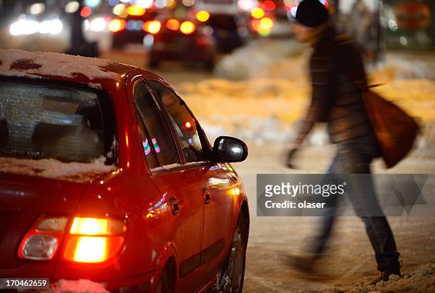 man on winter zebra crossing - pedestrian winter stock pictures, royalty-free photos & images