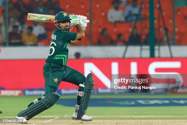 Babar Azam of Pakistan plays a shot during the ICC Men's Cricket World Cup India 2023 warm up match between Pakistan and Australia at Rajiv Gandhi...