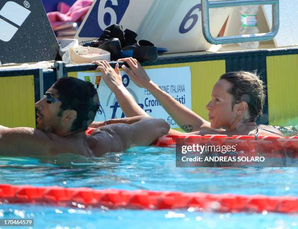 Italy's Federica Pellegrini looks to Italy's Filippo Magnini during the training session ahead the Women's 400 metres Freestyle final swimming event...