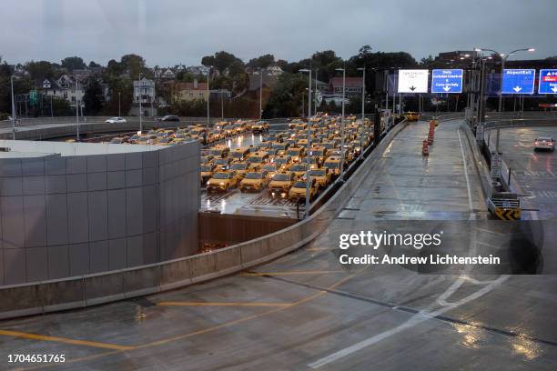 Taxi cabs wait for passengers to arrive at LaGuardia Airport, September 24, 2023 in Queens, New York.