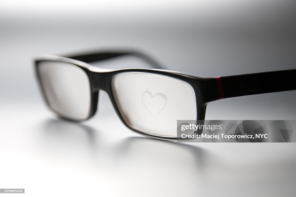 Foggy glasses with a drawn picture of heart