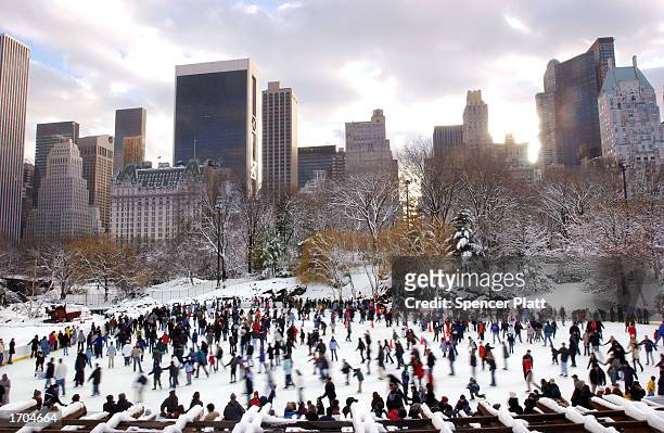 Crowd of people skate December 26, 2002 in New York City's Central Park. A northeaster left up to five inches of snow on New York City on Christmas...