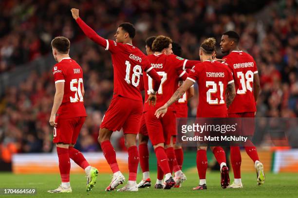 Cody Gakpo of Liverpool celebrates with teammates after scoring the team's first goal during the Carabao Cup Third Round match between Liverpool and...