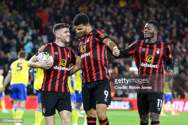 Dominic Solanke of Bournemouth celebrates after he scores a goal to make it 1-0 with team-mates Ryan Christie and Dango Ouattara during the Carabao...