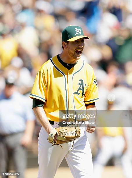 Jerry Blevins of the Oakland Athletics reacts after he struck out Kevin Youkilis of the New York Yankees with the bases loaded to end the top of the...