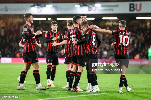 Joe Rothwell of Bournemouth is congratulated by team-mates after his free-kick deceives keeper Jack Bonham of Stoke City and goes straight in and he...