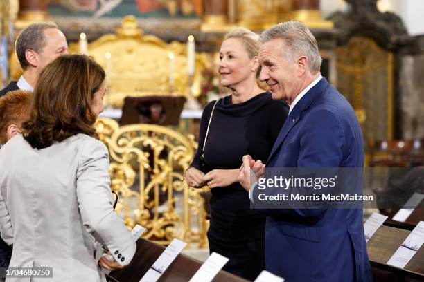 Former German President Christian Wulff and his wife Bettina attend a religious service at St. Michaelis church prior to celebrations on German Unity...