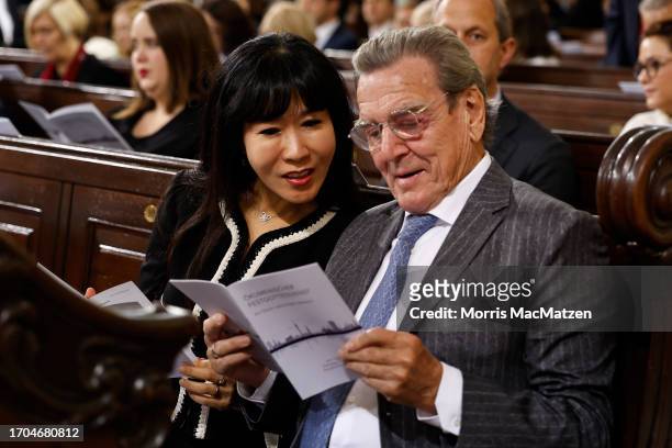 Former German Chancellor Gerhard Schroeder and his wife Schroeder-Kim So-yeon attand a religious service at St. Michaelis church prior to...