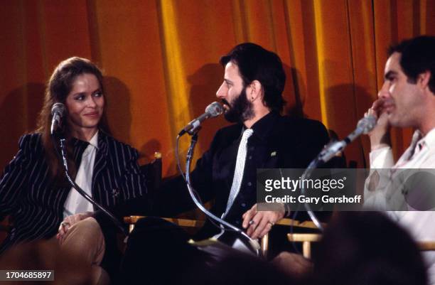 View of, from left, American actress Barbara Bach, British musician Ringo Starr, and comedian Robert Klein, during the recording of an episode of the...