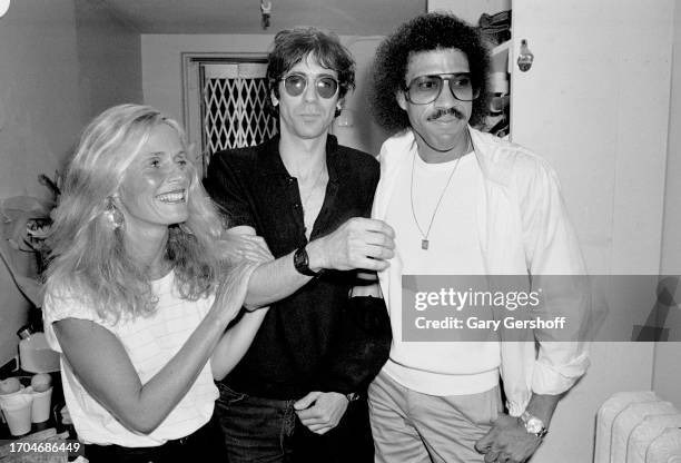 View of, from left, American musicians Kim Carnes, Peter Wolf, and Lionel Richie backstage at the Savoy, New York, New York, August 25, 1981. Carnes...