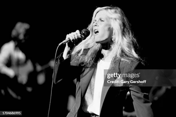 American Rock and Pop singer Kim Carnes performs, with her band, onstage at the Savoy, New York, New York, August 25, 1981.