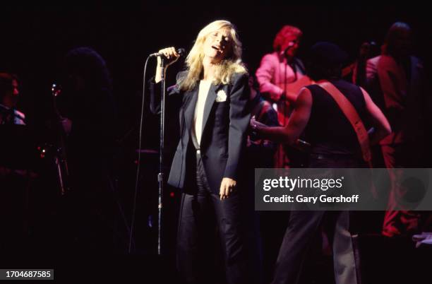 American Rock and Pop singer Kim Carnes performs, with her band, onstage at the Savoy, New York, New York, August 25, 1981.