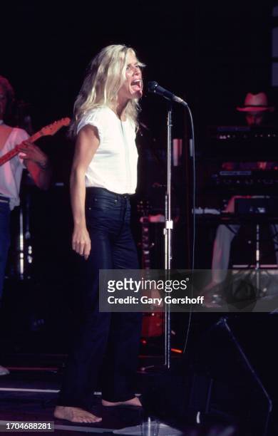 American Rock and Pop singer Kim Carnes performs, with her band, onstage at the Savoy, New York, New York, August 25, 1981.