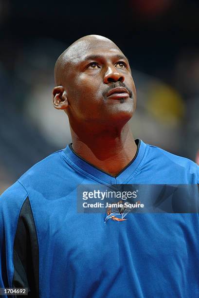Guard Michael Jordan of the Washington Wizards looks on wearing his warmup top against the Atlanta Hawks on December 17, 2002 at Phillips Arena in...