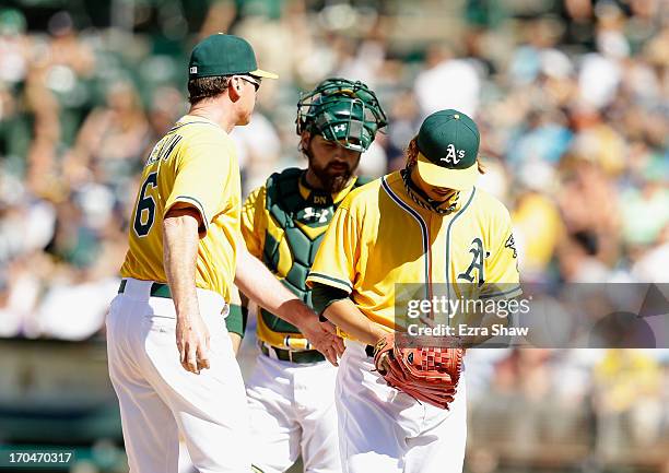 Hideki Okajima of the Oakland Athletics is taken out of the game by manager Bob Melvin during their game against the New York Yankees at O.co...